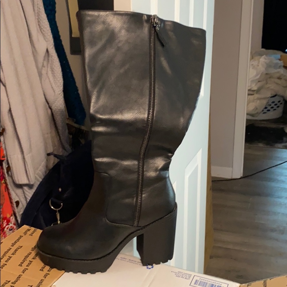 Torrid brand women’s black boots